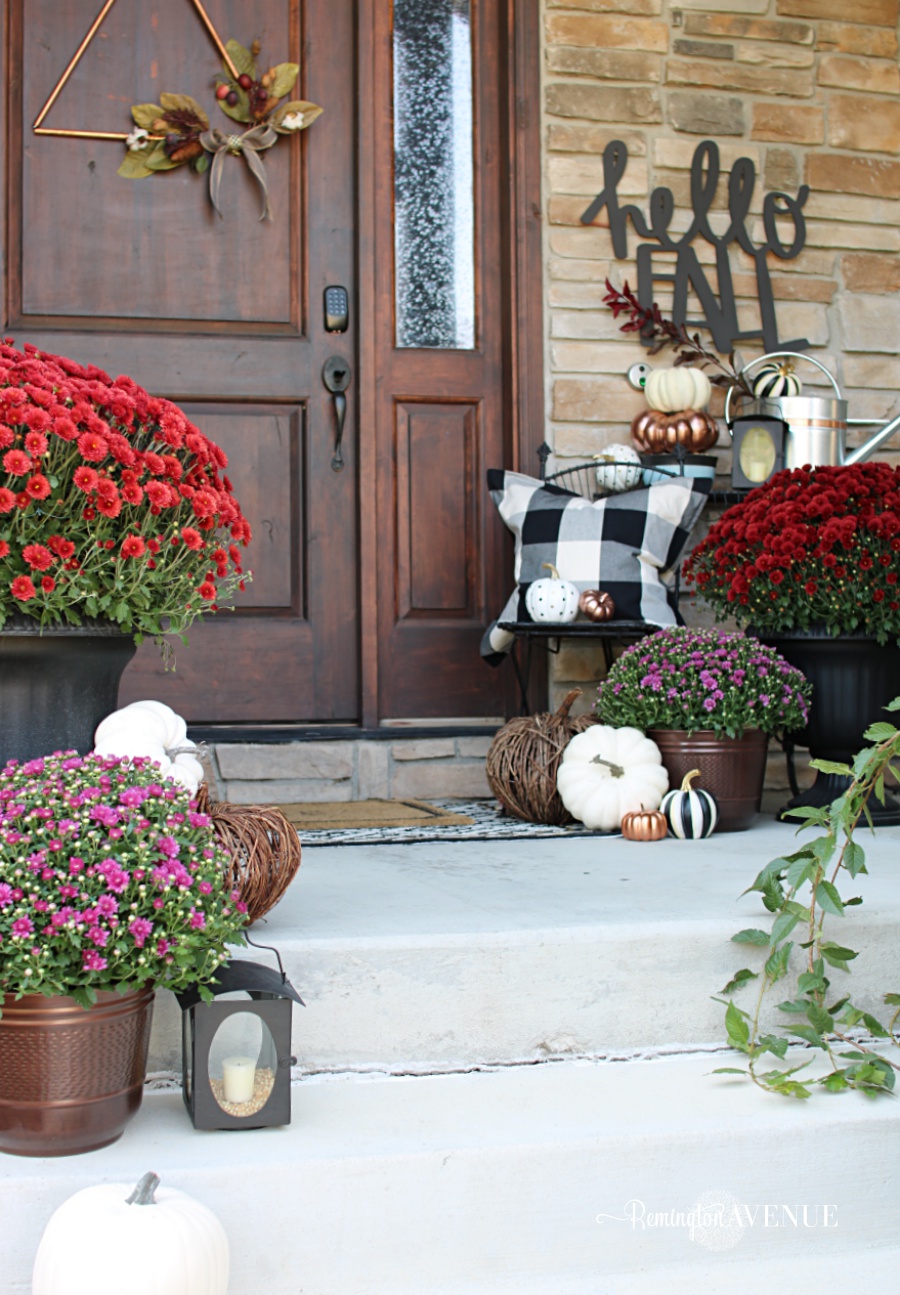 copper, jewel toned fall front porch with bold black and white patterns