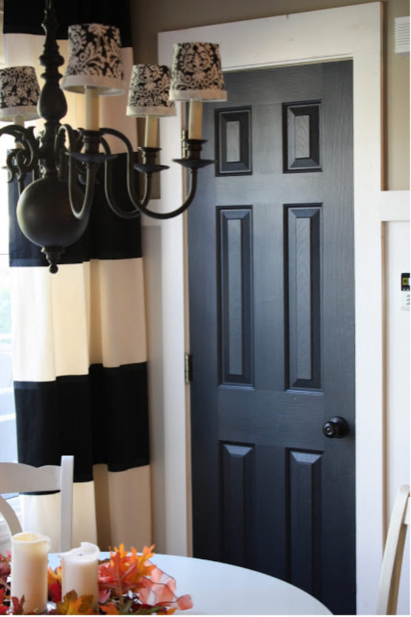 White Interior With Dark Painted Doors Builder Grade Door Painted Black 600x902 