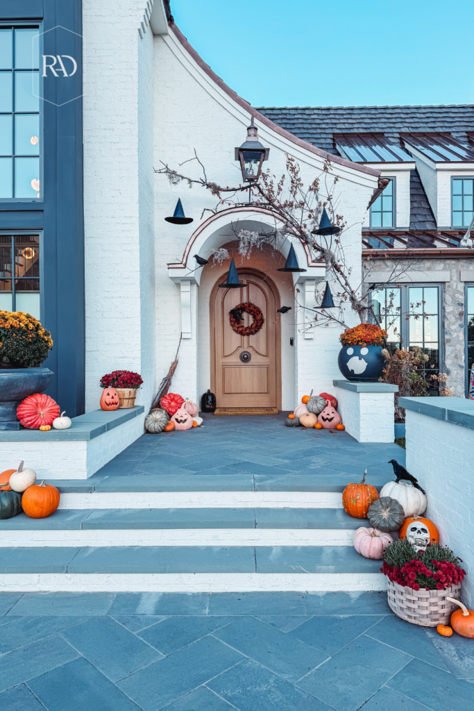 pumpkins on front porch and witch hats